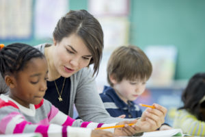 teacher and young students